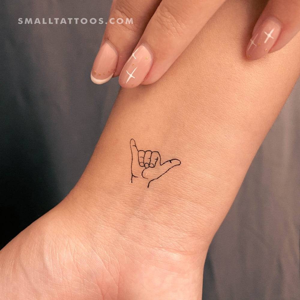 hand peace sign tattoo