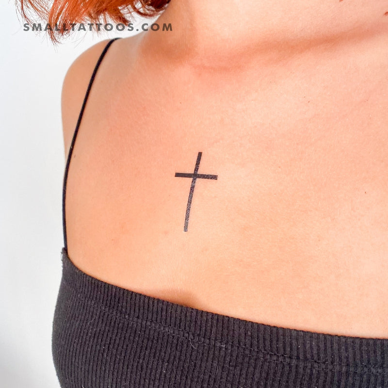simple cross tattoo with flowers wrapping around the cross