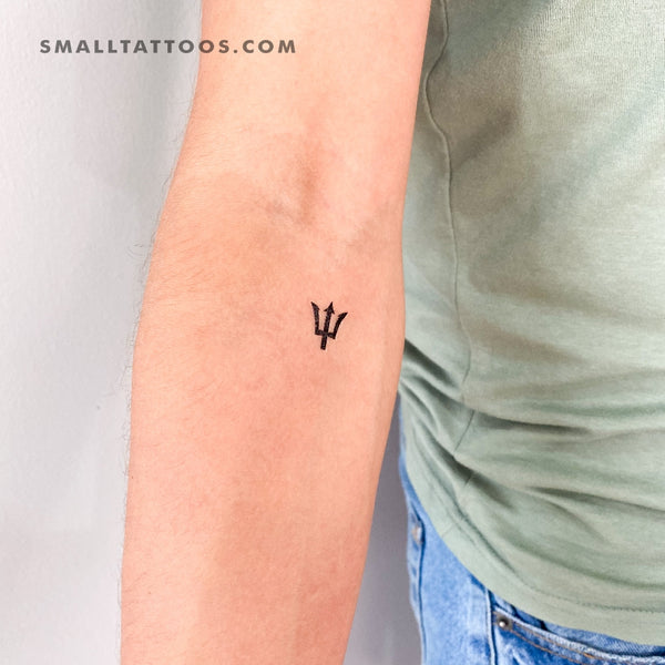Micro-realistic snake and sword tattoo located on the