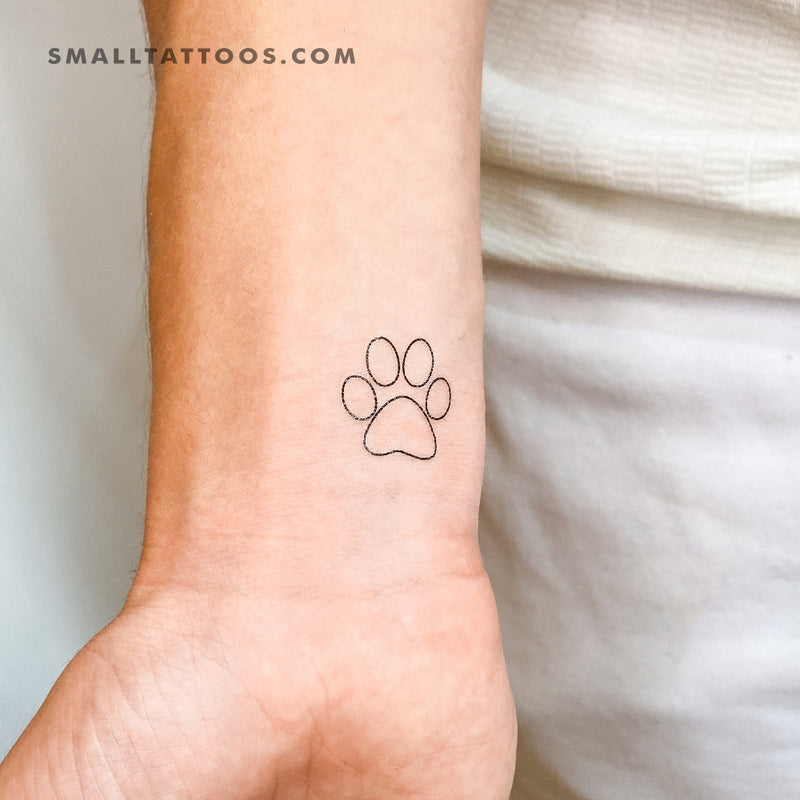 Paw print tattoo on the inner forearm