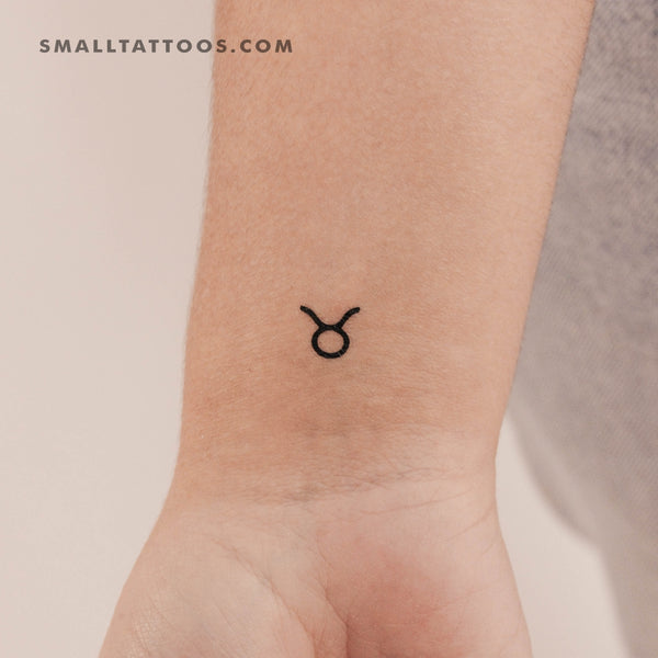 Minimalisticx style Taurus zodiac symbol tattoo located