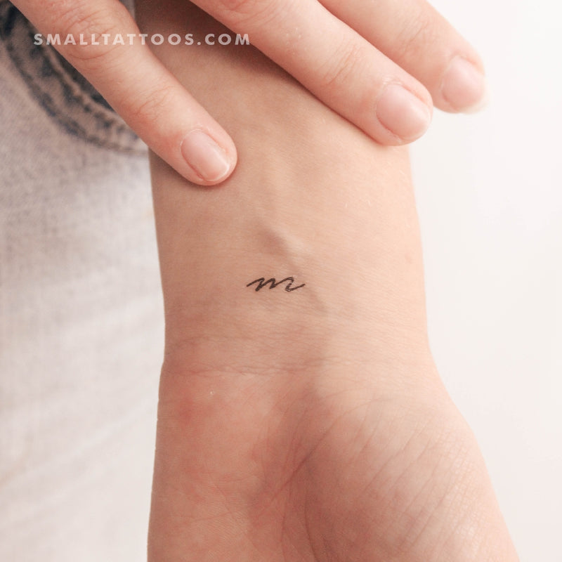 Tattoo tagged with: small, chang, micro, initials, m, tiny, ifttt, little,  behind the ear, latin script, minimalist, letter | inked-app.com