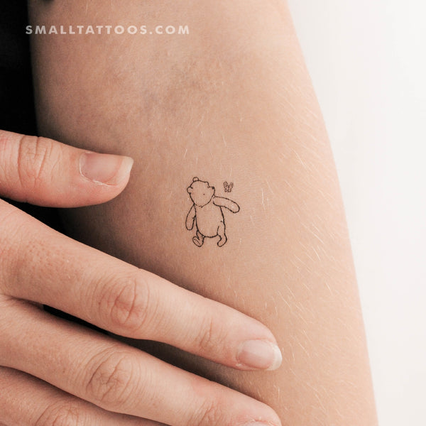 Tattoo tagged with: small, winnie the pooh, bear, micro, tiny, disney,  cartoon, ifttt, little, pooh bear, film and book, disney character, fine  line, cartoon character, fictional character, bicep, line art, animal,  playground |