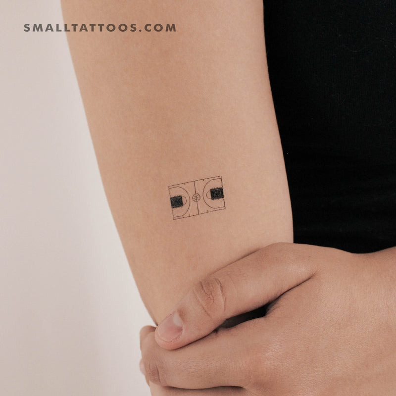 Micro camera tattoo located on the finger, minimalistic
