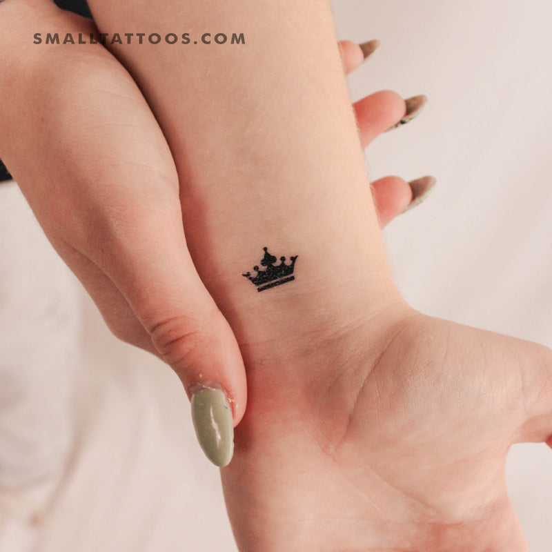 Basquiat inspired small crown tattoo on the right