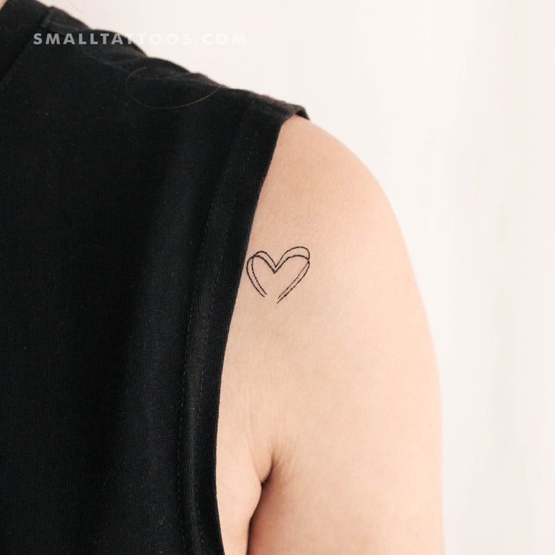 Tiny heart tattooed on the inner arm.