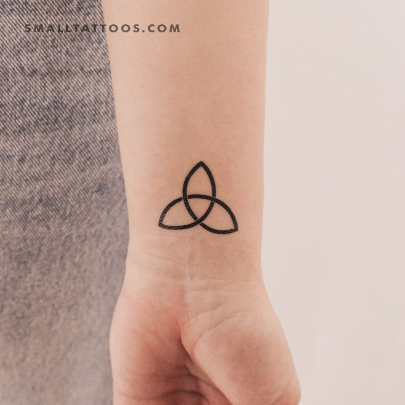 Triquetra in the form of a black and white tattoo. tattoo female, in the  form of a rose. naturalistic drawing. the tattoo should be small on Craiyon