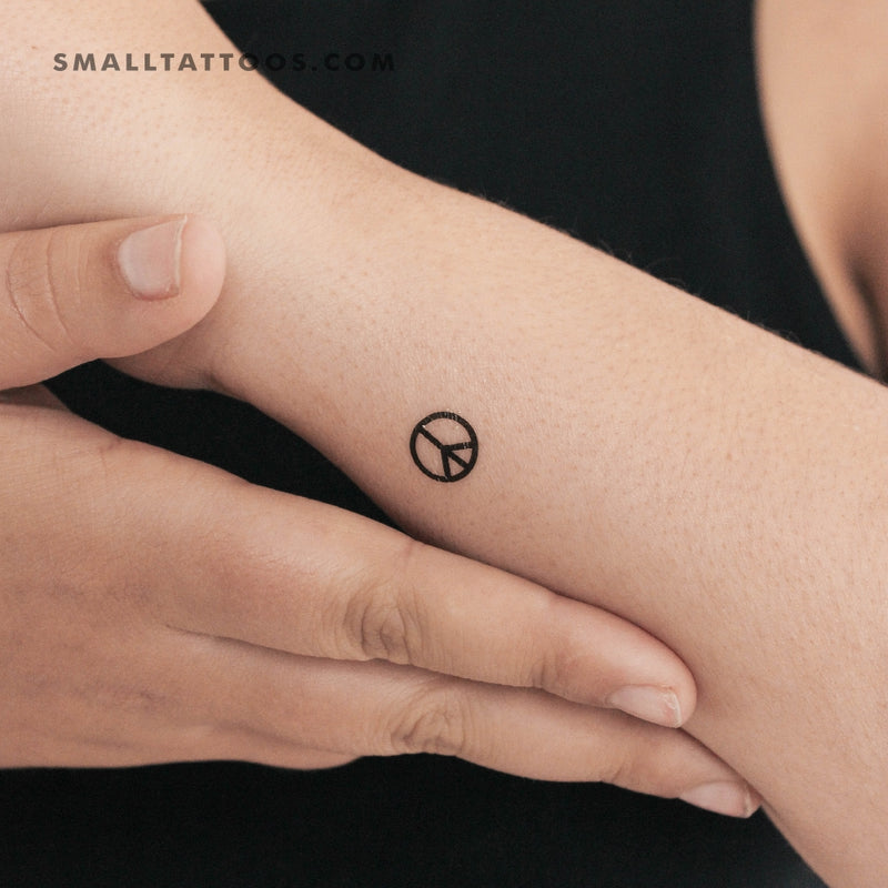 Tattoo uploaded by Stacie Mayer • Nothing says peace like a daisy chain peace  sign. Tattoo by @i_nosaint. #daisy #flower #dainty #blackandgrey #peace # peacesign #i_nosaint • Tattoodo