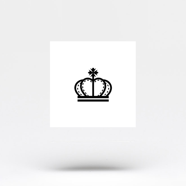 Minimalistic crown and diamond tattoo located on the