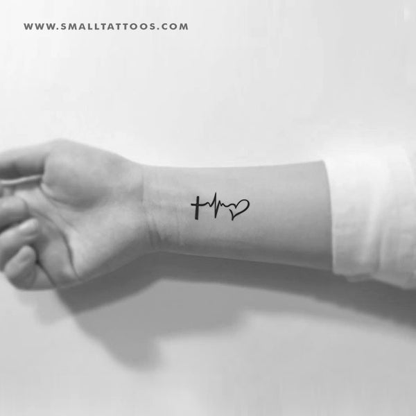 Minimalist faith hope love symbol tattoo located on the